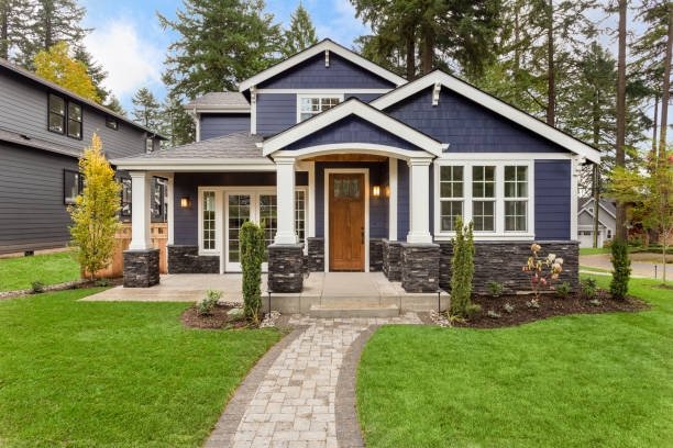 blue house with a green lawn